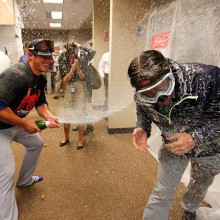 CINCINNATI, OH - SEPTEMBER 27: Anthony Recker #20 of the New York Mets sprays champagne as they celebrate in the clubhouse after defeating the Cincinnati Reds 10-2 to clinch the National League East Championship at Great American Ball Park on September 26, 2015 in Cincinnati, Ohio.  (Photo by John Sommers II/Getty Images)