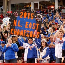 CINCINNATI, OH - SEPTEMBER 27: New York Mets' fans celebrate after their team defeated the Cincinnati Reds 10-2 to clinch the National League East Championship at Great American Ball Park on September 26, 2015 in Cincinnati, Ohio.  (Photo by John Sommers II/Getty Images)